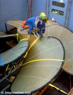 ID 1872 PORT OF SOUTHAMPTON, ENGLAND - Securing a large propeller aboard a container ship for export to a Japanese shipyard.